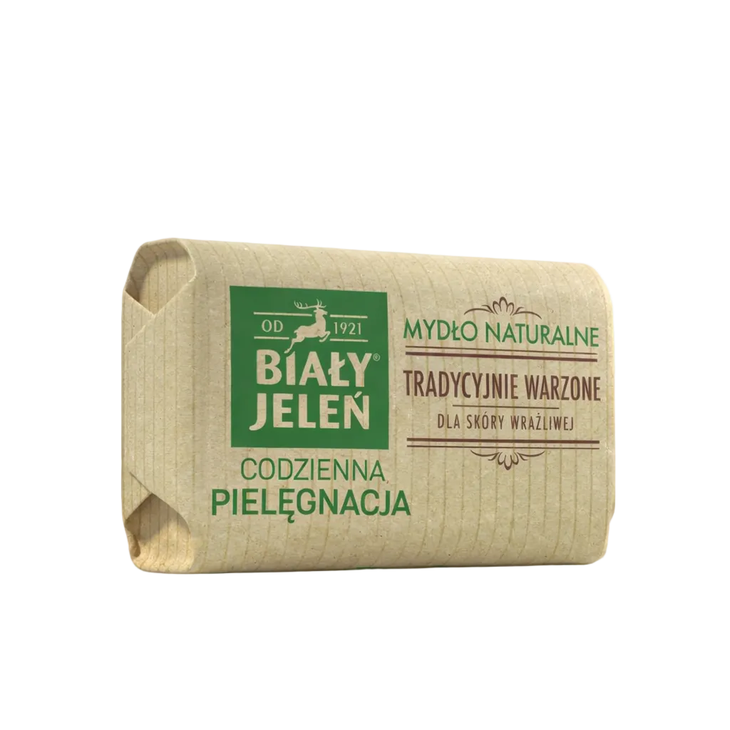 Bar of soap in a brown paper wrap with green text on a light gray background