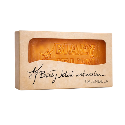 Bar of soap in a cardboard box with 'Biały Jeleń' branding on a white background