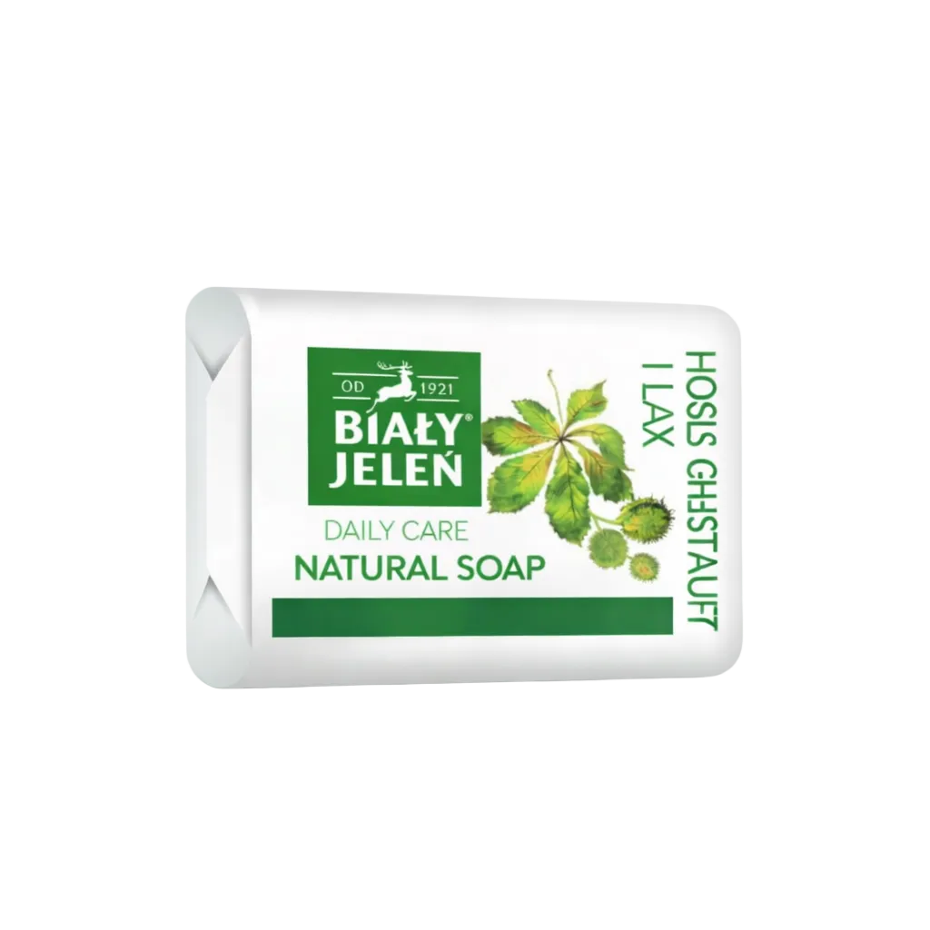 Bar of Bialy Jelen natural soap with green label on a white background