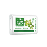 Bar of Bialy Jelen natural soap with green label on a white background