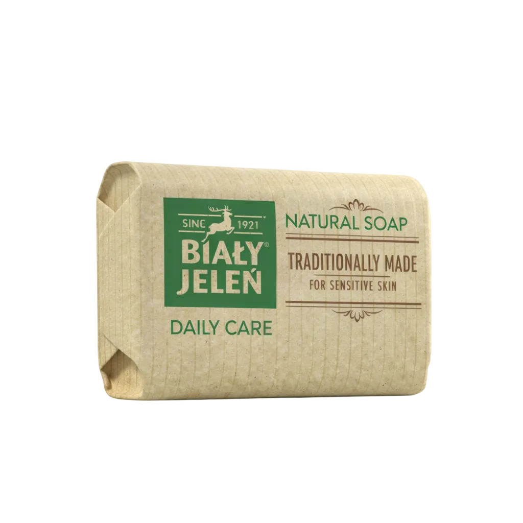 Bar of natural soap with Bialy Jelen branding on a light background