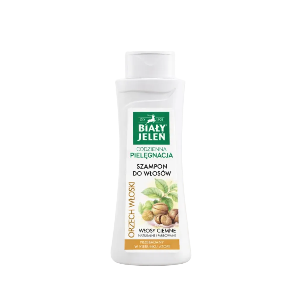 Bottle of Bialy Jelen shampoo with a green label on a light beige background