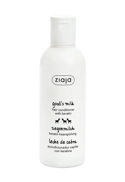 A white plastic bottle of ziaja Goat's Milk Hair Conditioner with Keratin, featuring black text and small goat illustrations on a clean white background.