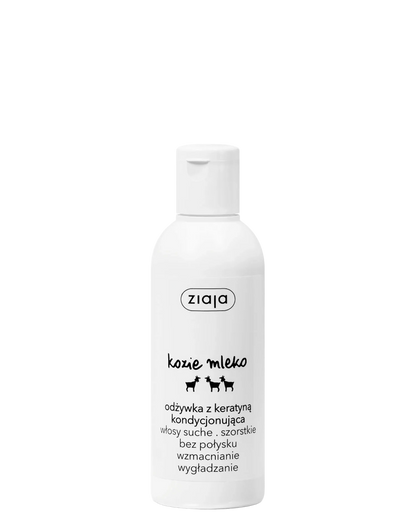 A white plastic bottle of ziaja kozie mleko dog hair conditioner with black text and small dog silhouettes, set against a plain white background.