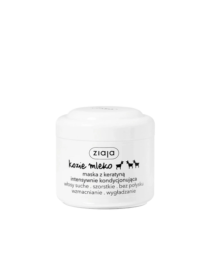 A white plastic jar of Zioja 'Coś mleko' dog hair mask with black text and logo, set against a plain white background.
