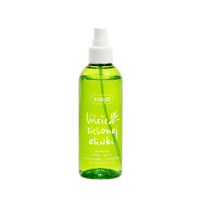 Green spray bottle with white nozzle on a white background