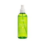 Green bottle of olive toner with vitamin C by Ziaja on a white background