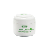 Ziaja Olive Cream Anti-Wrinkle 30+ jar on a light green background